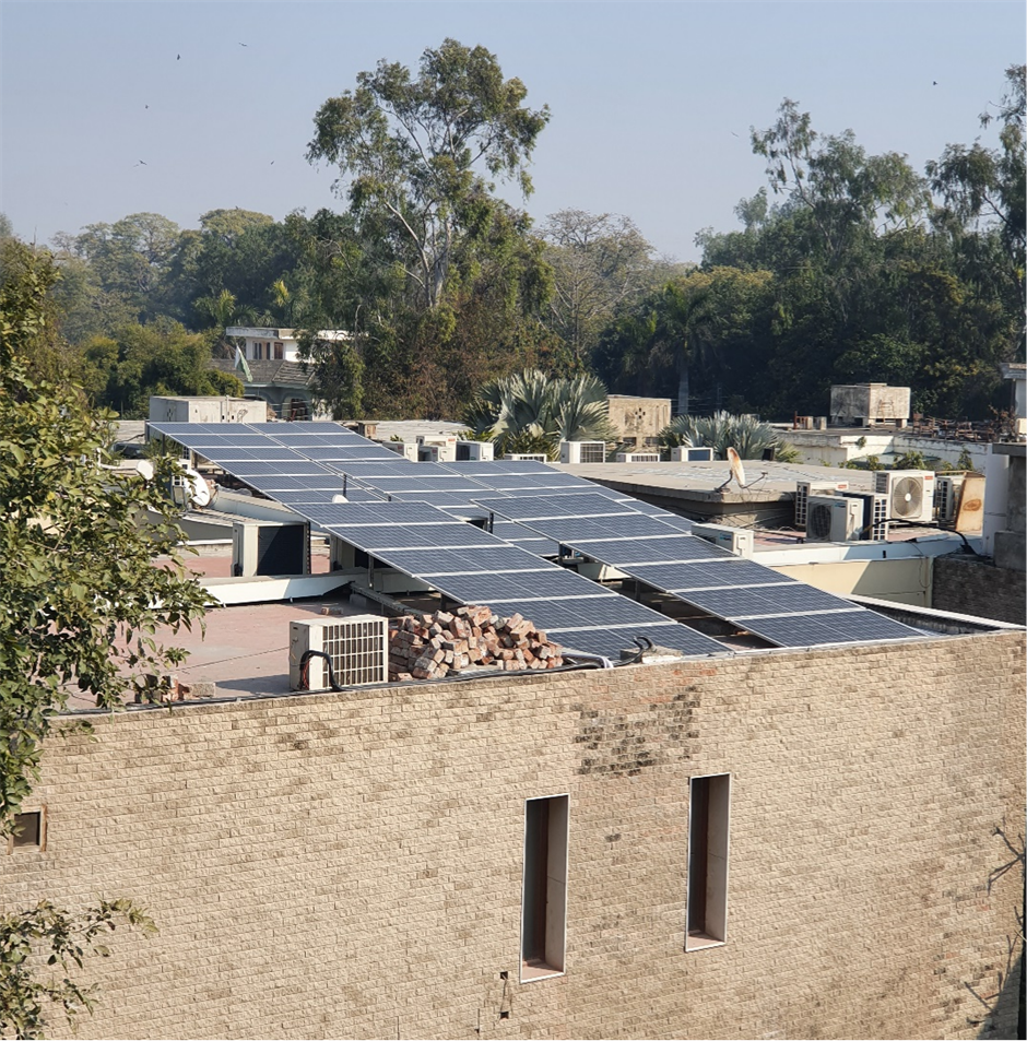 Solar panels installed on the rooftop of an industrial building in Lahore, Pakistan